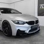Performance Priekinio bamperio Pažeminimas skirtas BMW F80 / F82 / F83, juodas blizgus - V2 SUTVIRTINTA VERSIJA